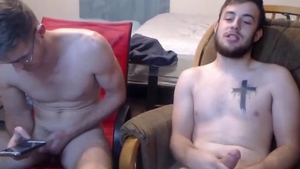 Two males Jerking And Cumming Onto The Glass Desk